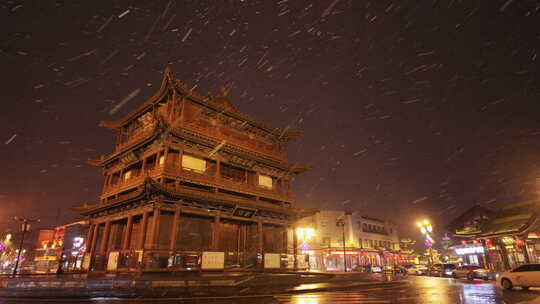 山西大同古城鼓楼夜景飘雪下雨雪景