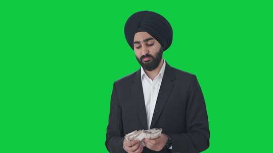 悲伤的锡克教印度商人数钱绿屏视频素材模板下载