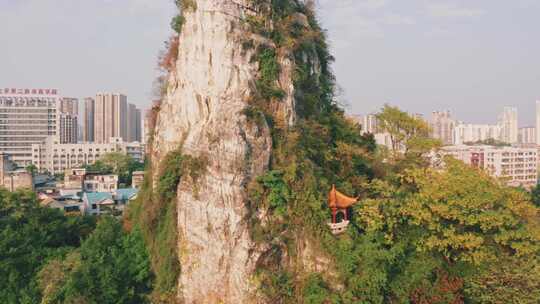 航拍广西柳州箭盘山公园山峰与建筑