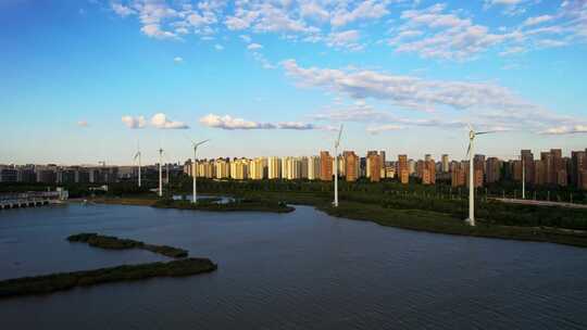 河堤河道旁风力发电机组城市风光自然风景