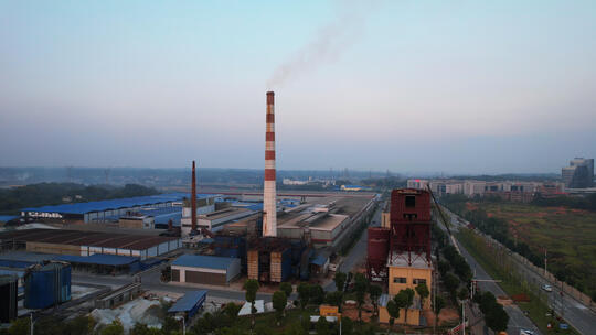 航拍城市郊区开发区工业园厂房与烟囱