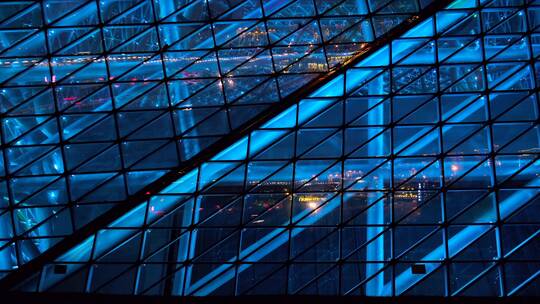 现代城市建筑玻璃幕墙蓝色灯光秀