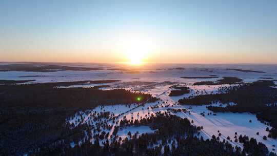 航拍林海雪原松林唯美夕阳