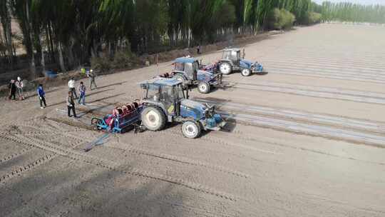 航拍中国新疆春季 棉花机械播种