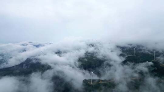 航拍穿云海清洁能源风力发电风车