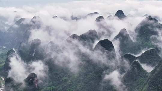 航拍桂林云海下的山峰