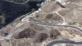 航拍山间蜿蜒公路高清在线视频素材下载