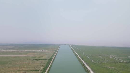 宁波慈溪杭州湾湿地草坪4K航拍视频素材模板下载