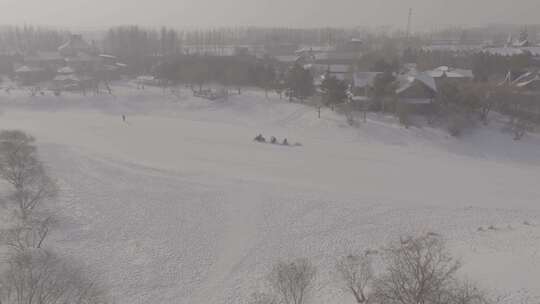 哈尔滨伏特加庄园游客做雪车游玩雪景航拍