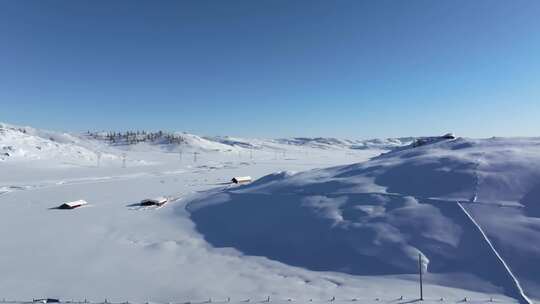 航拍新疆阿勒泰吉木乃草原石城雪原输电线路