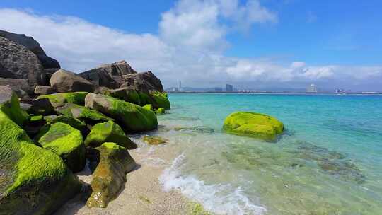 海南三亚海岸线上礁石沙滩海浪微距慢镜