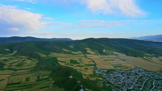 村庄田野丘陵大地丰收航拍大景