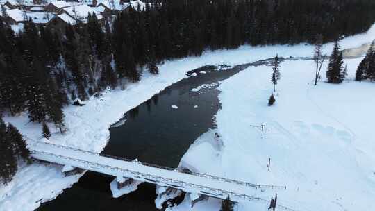 航拍新疆冬季喀纳斯湖雪景雪山森林冰河寒冷