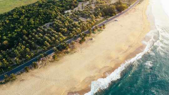 4K航拍海南万宁日月湾海边椰林公路