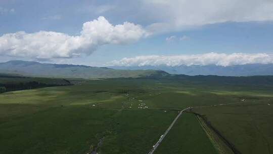 航拍那拉提公路草地和远景广景