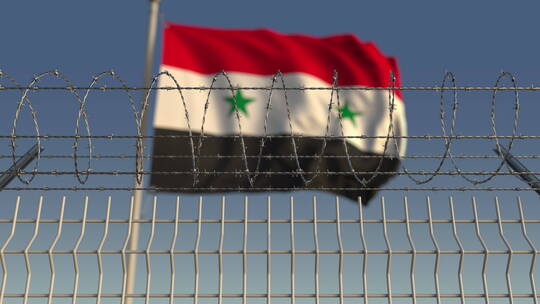铁丝网后的叙利亚国旗