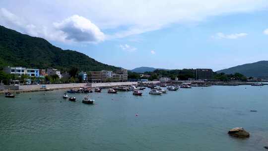 航拍深圳大鹏繁华热闹的东山码头海鲜市场