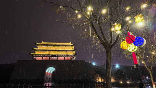 山西大同古城鼓楼夜景飘雪下雨雪景