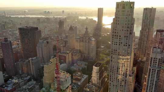 航拍纽约曼哈顿翠贝卡摩天大楼哈德逊河日出视频素材模板下载