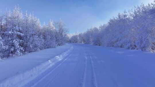 航拍森林雾凇山间冰雪道路