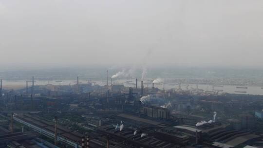 航拍城市工业生产工厂烟冲