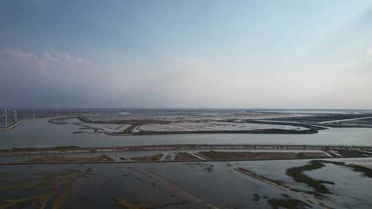 大海海边沙滩风力发电风车航拍