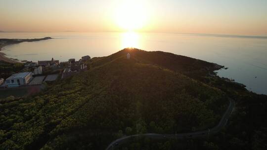 航拍威海玛伽山天文台的夕阳大海