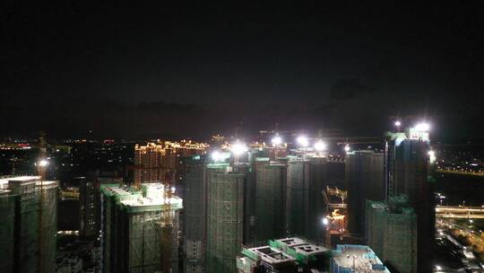 建筑工地楼盘夜景航拍建设中楼盘