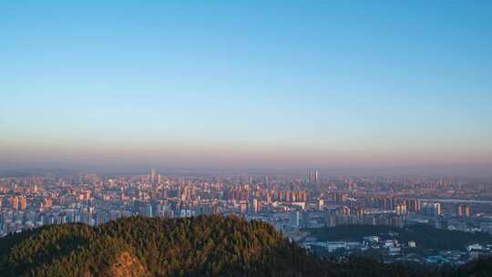 云南省昆明市高视角城市风光日转夜延时摄影