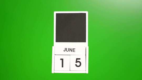 06.绿色背景上日期为6月15日的日历。