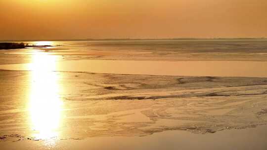 航拍高邮湖结冰夕阳视频素材模板下载