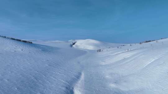 航拍寒冬辽阔纯净雪原湛蓝天空