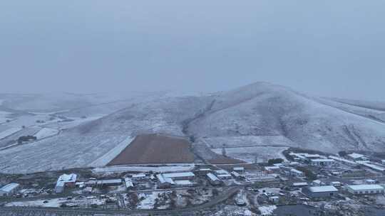 航拍风雪交加的山村视频素材模板下载