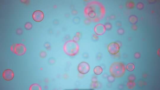 美丽的彩色肥皂泡被粉色灯光照亮，在蓝色背景下飞向室内