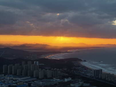 航拍威海高区西海岸城市远山海岸夕阳延时