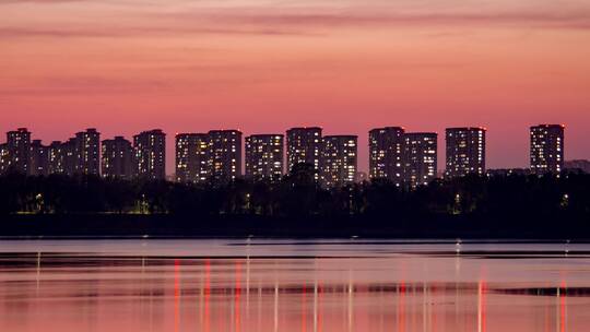 晚霞城市河水岸边建筑楼房夜晚灯光