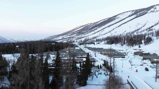 航拍新疆冬季喀纳斯湖雪景雪山森林冰河寒冷