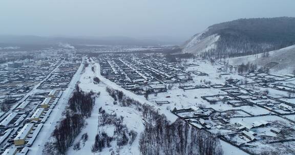 航拍大兴安岭林场山村人家雪景