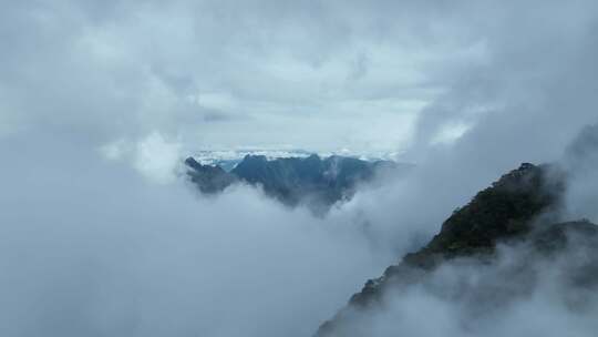 航拍云雾中飞行的无人机仙山云海来宾圣堂山