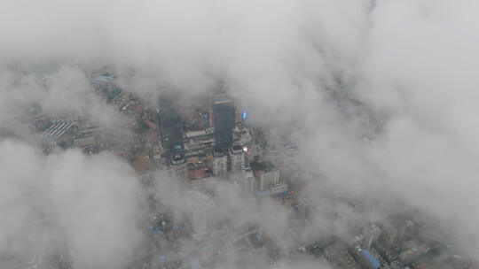 高空航拍云海中俯瞰城市建筑