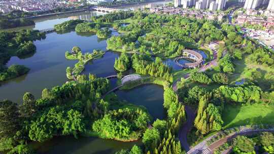 四川眉山东坡城市湿地公园城市风光日落航拍