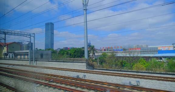 高铁动车窗外城市高楼建筑景观