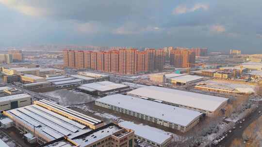 冬季航拍烟台大雪后的城市建筑和晚霞风景