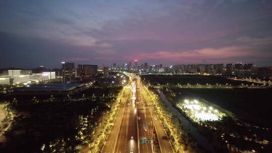 航拍夜晚江苏南通高架道路和现代城市风光
