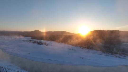 航拍雪原冰河冻雾日出