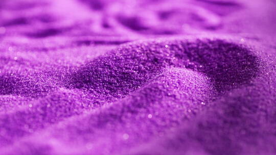 紫色沙子被风吹起美妆抽象镜头