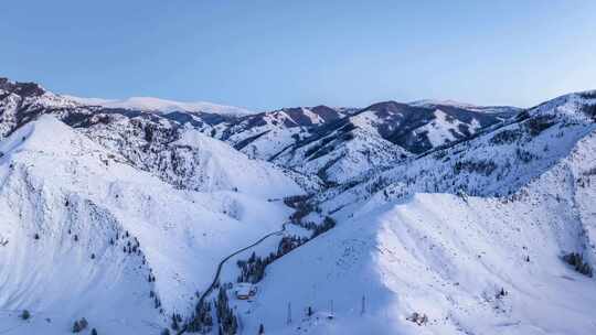 新疆可可托海雪山日落航拍延时日转夜