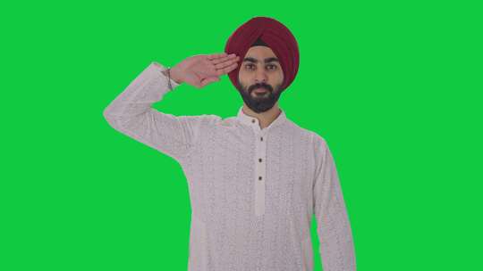 骄傲的锡克教印度人向绿屏敬礼视频素材模板下载