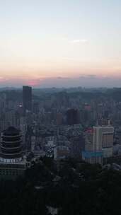 竖版航拍贵阳东山寺晚霞夜幕降临