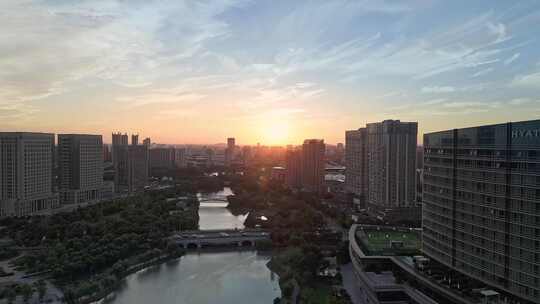 航拍上海松江五龙湖公园景观桥日落风光